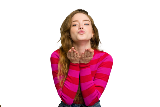 Young caucasian redhead woman isolated folding lips and holding palms to send air kiss. - Powered by Adobe