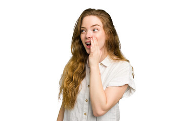 Young caucasian redhead woman isolated being shocked because of something she has seen.