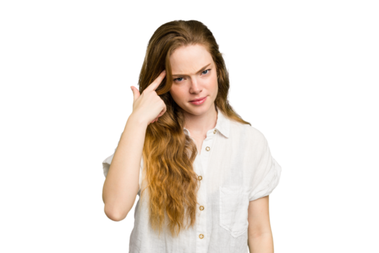 Young caucasian redhead woman isolated pointing temple with finger, thinking, focused on a task.