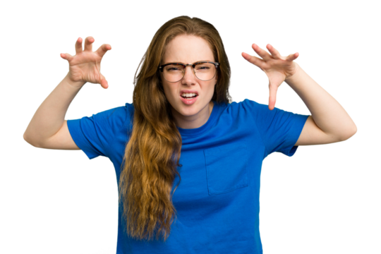 Young caucasian redhead woman isolated showing claws imitating a cat, aggressive gesture.