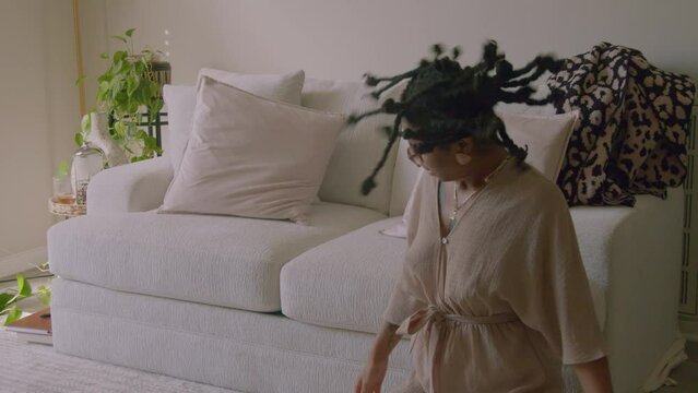 Young woman letting loose through dance and movement