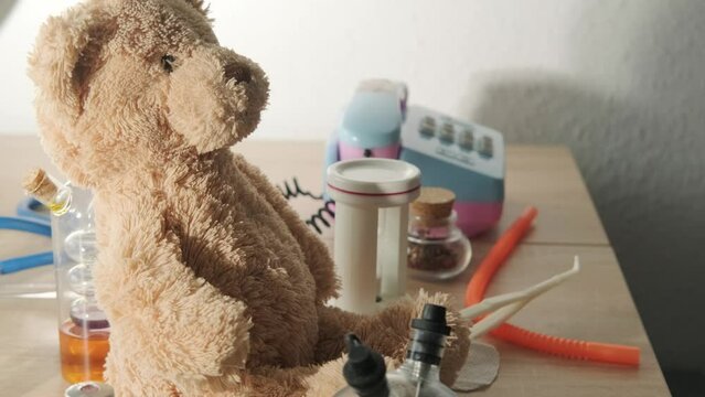 close-up teddy bear, child, girl 3 years old treats little patient, favorite toy, first friend concept, happy childhood, first impressions, medical professional support, health insurance and care
