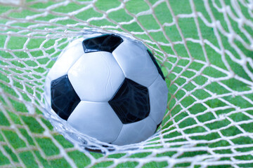 Fototapeta na wymiar soccer ball in the net