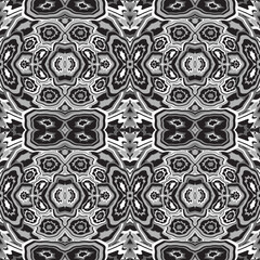 Abstract seamless pattern of stylized geometric motifs in black and white colors