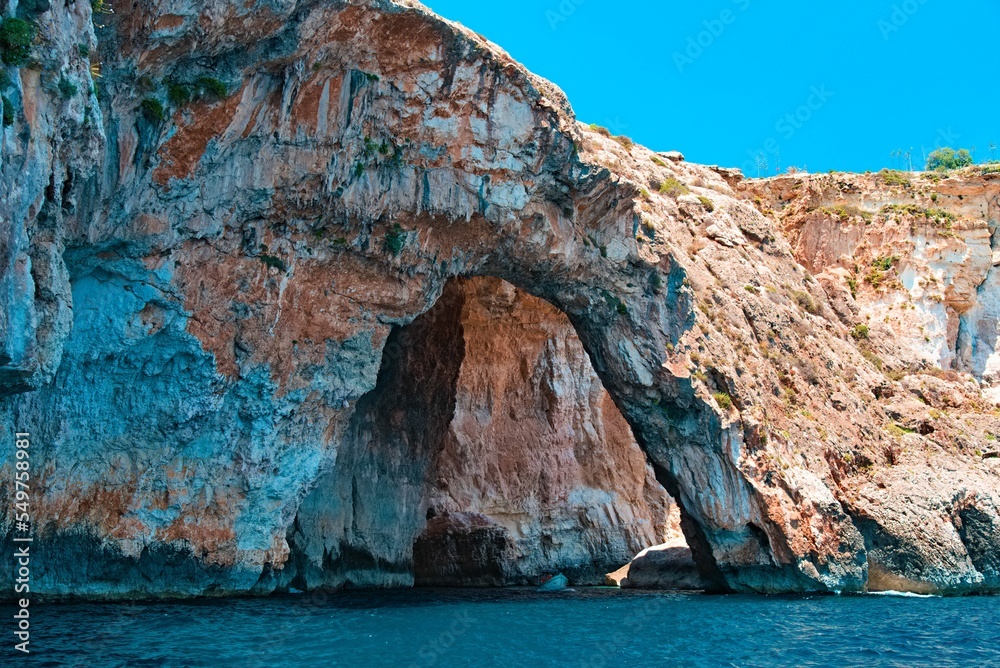 Sticker beautiful shot of the blue grotto sea caves in malta