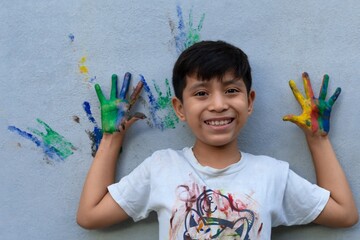 happy child with painted hands