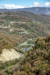 Fototapeta na wymiar view of the valley of the Mzymta river with built structures in Adler