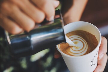 pouring coffee in a cup