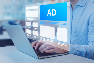 Programmatic in-feed advertisement on computer screen. Person viewing website with inbound ads to...