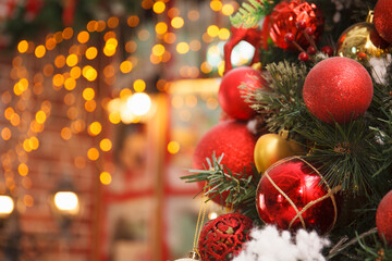 Christmas, New Year decor for fir tree red and golden balls on lights bokeh background. Selective focus