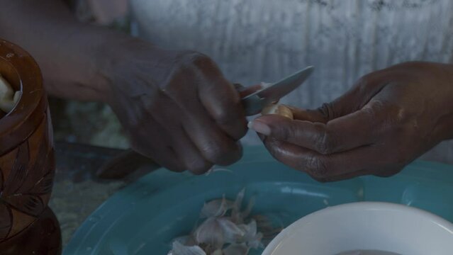 Peeling garlic by hand