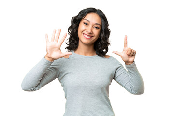 Young Argentinian woman over isolated background counting seven with fingers