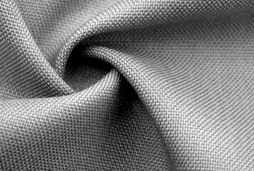 black fabric background with folds and waves. Textile. Material. Texture