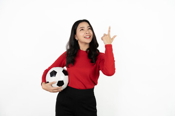 Happy Asian woman football fan cheer up support favorite team with soccer ball isolated on white background.