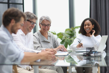 Fototapeta premium Conversation between managers and employees in the office at the table