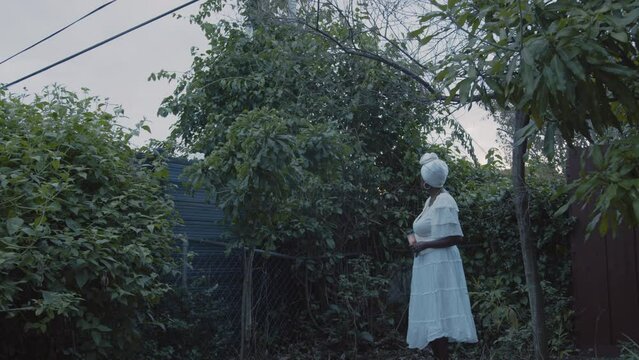 Woman talking in her garden