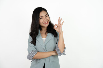 Portrait happy Asian woman shows ok sign and looking at the camera on white background.