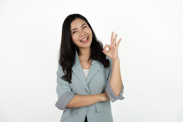Portrait happy Asian woman shows ok sign and looking at the camera on white background.