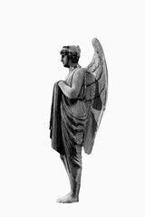 An ancient statue of angel in profile. Black and white image.