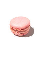 Strawberry macaron on a white background, delicious little cake made with almond flour typical of French pastries