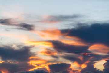 The dramatic colors of the sunset in the sky gradient from blue to orange.