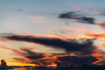 The dramatic colors of the sunset in the sky gradient from blue to orange.