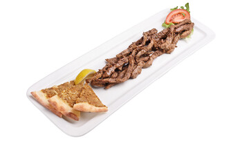 Slices of arabic dish pork shawarma on a plate