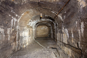 Fototapeta na wymiar Old gold mine underground tunnel with concrete lining