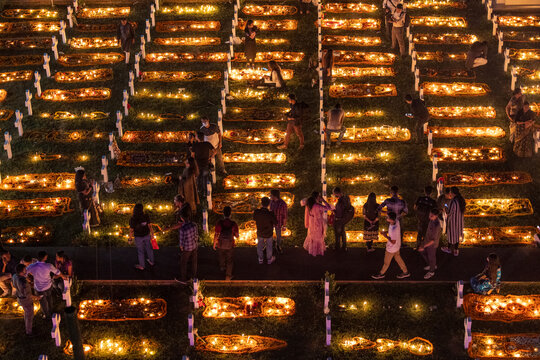 Dhaka, Bangladesh - 02 November 2018: Aerial view of a people praying on a graveyard in a cemetery in Dhaka, Bangladesh.