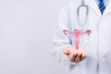doctor in a white coat holding virtual uterus reproductive system , woman health, PCOS, ovary...
