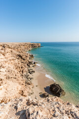 Top view from cliff of a wild beach at the coat of Ras Al Jinz, Sultanate of Oman.