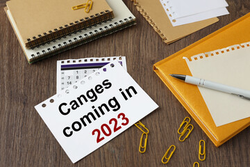Change coming in 2023. Business concept. text paper close-up. beautiful working table