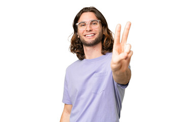 Young handsome man over isolated background smiling and showing victory sign