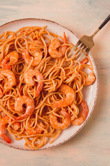 Spaghetti with king shrimps , with spices, top view, selective focus, homemade, no people,