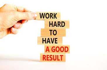 Work hard for result symbol. Concept words Work hard to have a good result on wooden blocks on a beautiful white table white background. Businessman hand. Business work hard for good result concept.