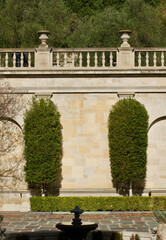 Fototapeta premium formal garden fortified with tall stone walls and balustrade