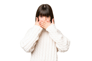 Little caucasian girl over isolated background covering mouth with hands