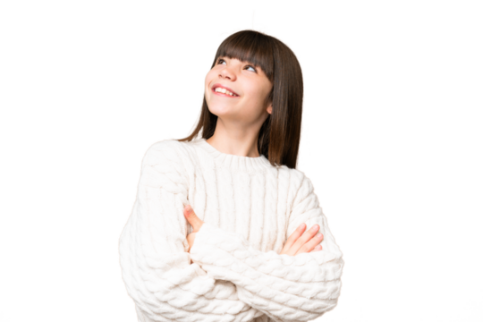 Little caucasian girl over isolated background looking up while smiling