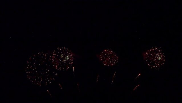 Amazing beautiful colorful firework display over sea on celebration night. Fireworks show for happy new year	