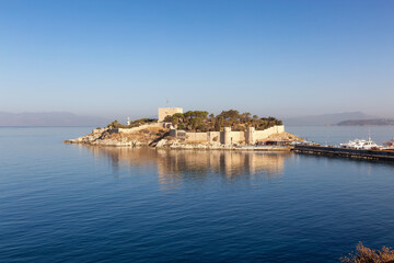 Fototapeta premium Historic Landmark, Kusadasi Castle, in a Touristic Town by the Aegean Sea. Kusadasi, Turkey. Sunny Morning Sunrise.