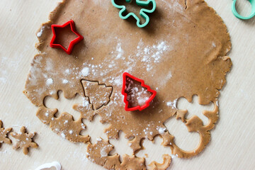 Dough for ginger cookies with Christmas molds.