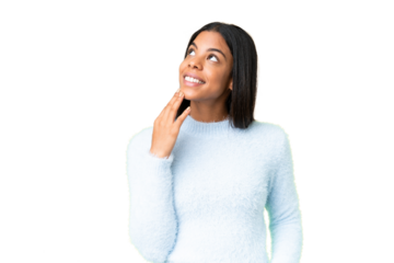 Young African American woman over isolated chroma key background looking up while smiling