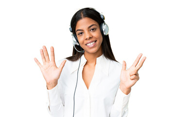 Telemarketer African American woman working with a headset over isolated chroma key background counting eight with fingers