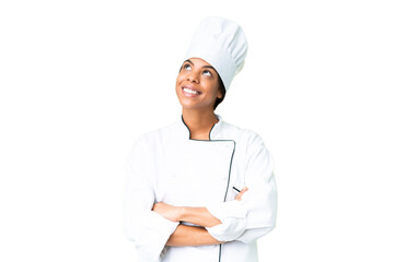 Young African American chef over isolated chroma key background looking up while smiling