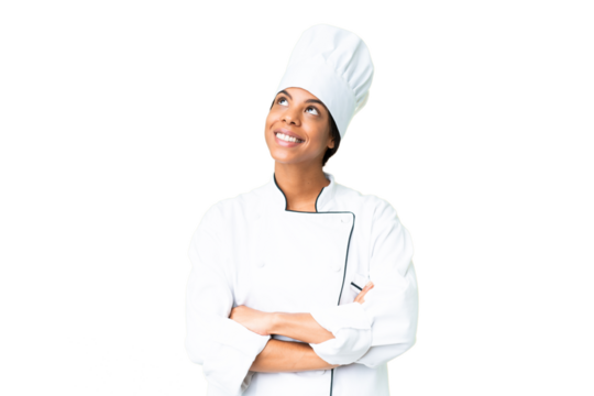 Young African American chef over isolated chroma key background looking up while smiling