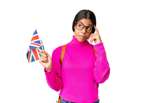 Young African American woman holding an United Kingdom flag over isolated chroma key background thinking an idea