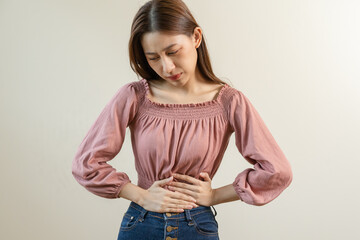 Flatulence young asian woman, girl hand in stomach ache, suffer from food poisoning, abdominal pain...