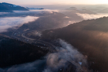 Panorama of a Ukrainian mountain village, a view of the village among the clouds from above.