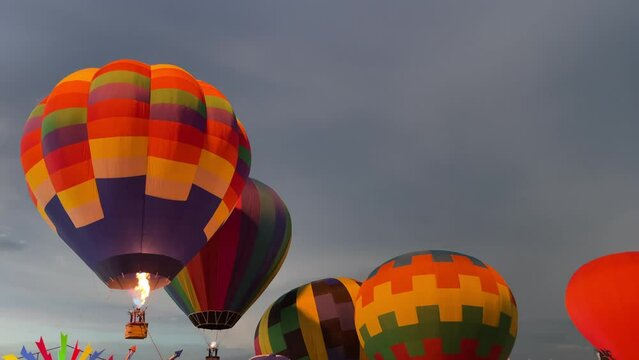 Pattaya, Thailand. Colourful hot air balloon flying with beautiful sky in the evening with basket floating aerial view.