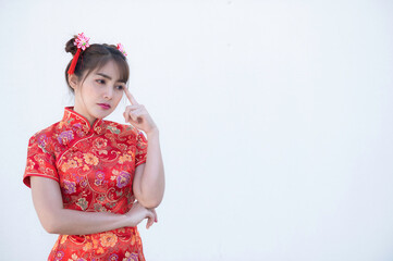 Portrait beautiful asian woman in Cheongsam dress on white background,Thailand people,Happy Chinese new year concept,Happy  asian lady in chinese traditional dress